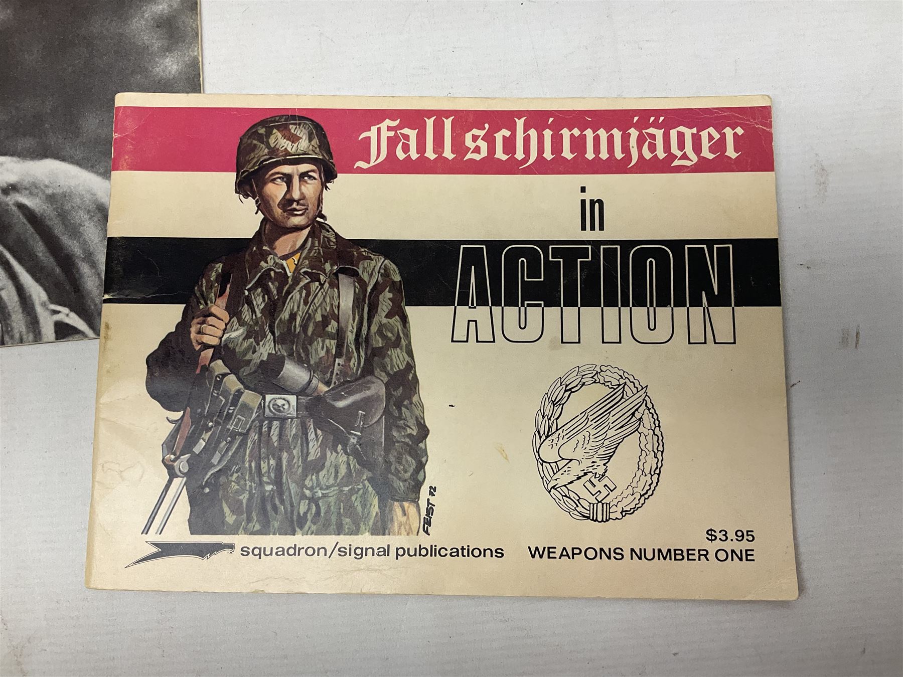 Adolf Hitler, Bilder aus dem Leben des Fuhrers [Pictures from the Life of the Fuhrer], Herausgegeben vom Cigaretten / Bilderdienst, Hamburg / Bahrenfeld, 1936, an album of two hundred tipped-in cards bearing photographs by Heinrich Hoffman, originally collected with cigarettes, 31 cm x 24 cm; together with a Waffen-SS book 'Wenn alle Bruder schweigen'; Hamburg 1939-1945; and two other booklets