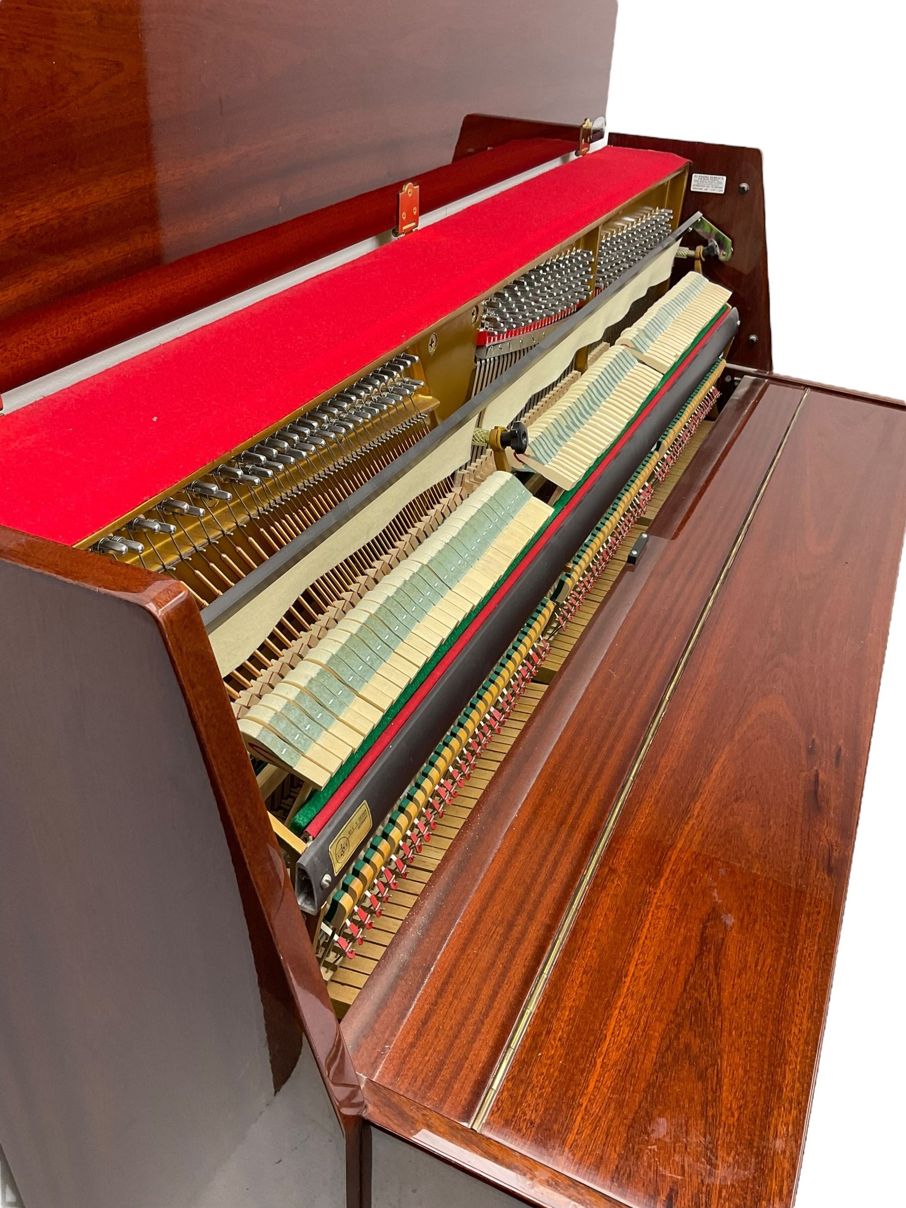 Steinmayer upright series 108 piano in sapele mahogany case, with an overstrung Iron frame and underdamper action, sustain, sostenuto and practise pedal, full compass seven octave 88 note keyboard serial Number 97050003 