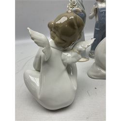 Four Lladro figures, comprising Angel Dreaming no 4961, Angel Wondering no 4962, Little Girl with Slippers no 4523, Boy and Girl in Nightgowns no 4874 and Boy From Madrid 4898