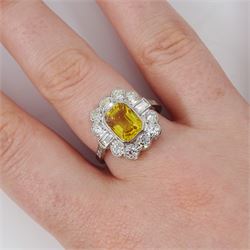 Platinum yellow sapphire and diamond milgrain set cluster ring, single octagonal cut sapphire of approx 2.20 carat, surrounded by two baguette cut diamonds and ten transitional cut diamonds and diamond set shoulders, stamped Plat, total diamond weight approx 0.95 carat