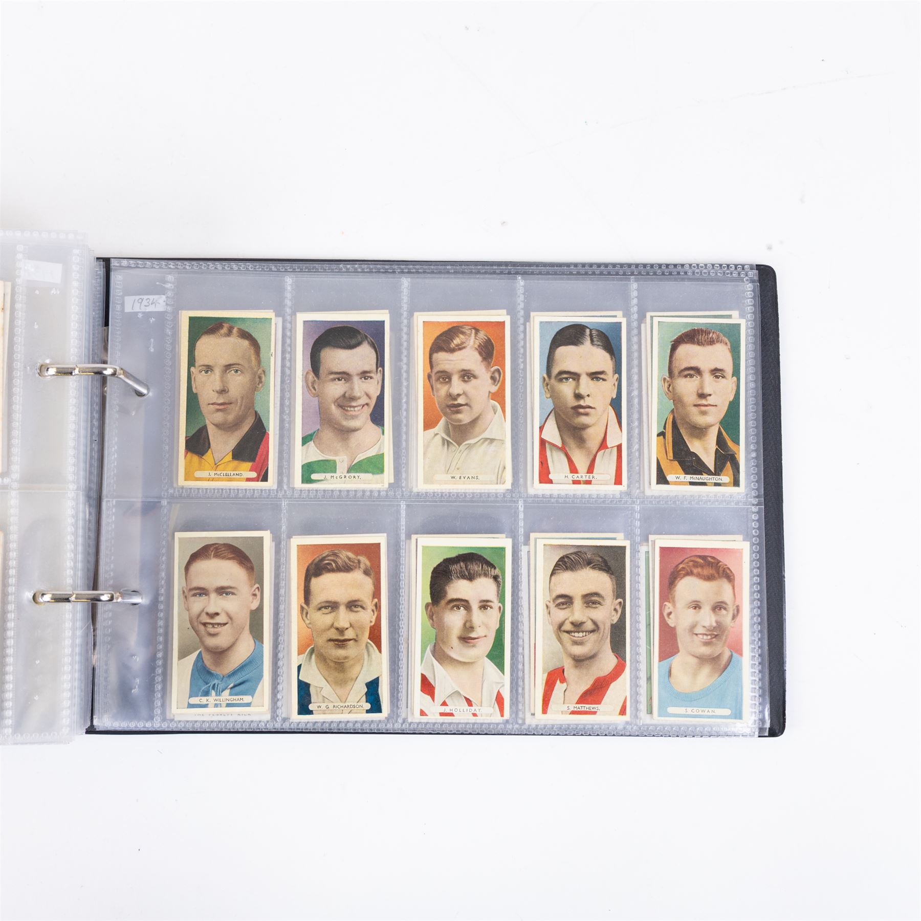 Collection of Edwardian and later Football related trading and cigarette cards, including forty-nine of fifty 1906 Ogden's Football Club Colours, 1922 PALS Footall series, ninety of one hundred 1925 Gallaher Famous Footballers, complete set of forty-four 1926 Ogden's Captains of Association Football Clubs and Colours, complete set of fifty 1927 Players Football Caricatures by MAC,  complete set of fifty 1927 Players Football Caricatures by RIP,  complete set of fifty 1930 Players Association Cup Winners, complete set of 50 1933 Ogdens AFC Nicknames etc, housed in brown cigarette card album