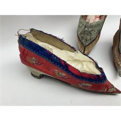 Two pairs of Chinese silk embroidered lotus shoes, for bound feet, one example with floral decoration upon a red ground with blue band, and a similar smaller pair, largest L15cm