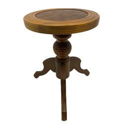 Beech adjustable piano stool, with leather inset seat embossed with floral Art Nouveau style decoration, on turned ribbed globular column with three splayed supports