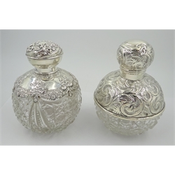  Edwardian silver mounted globular cut glass scent bottle, the body decorated with floral wreaths and swags, with internal glass stopper and another, by Boots Pure Drug Company, 1906 and 1912 H12.5cm (2)   