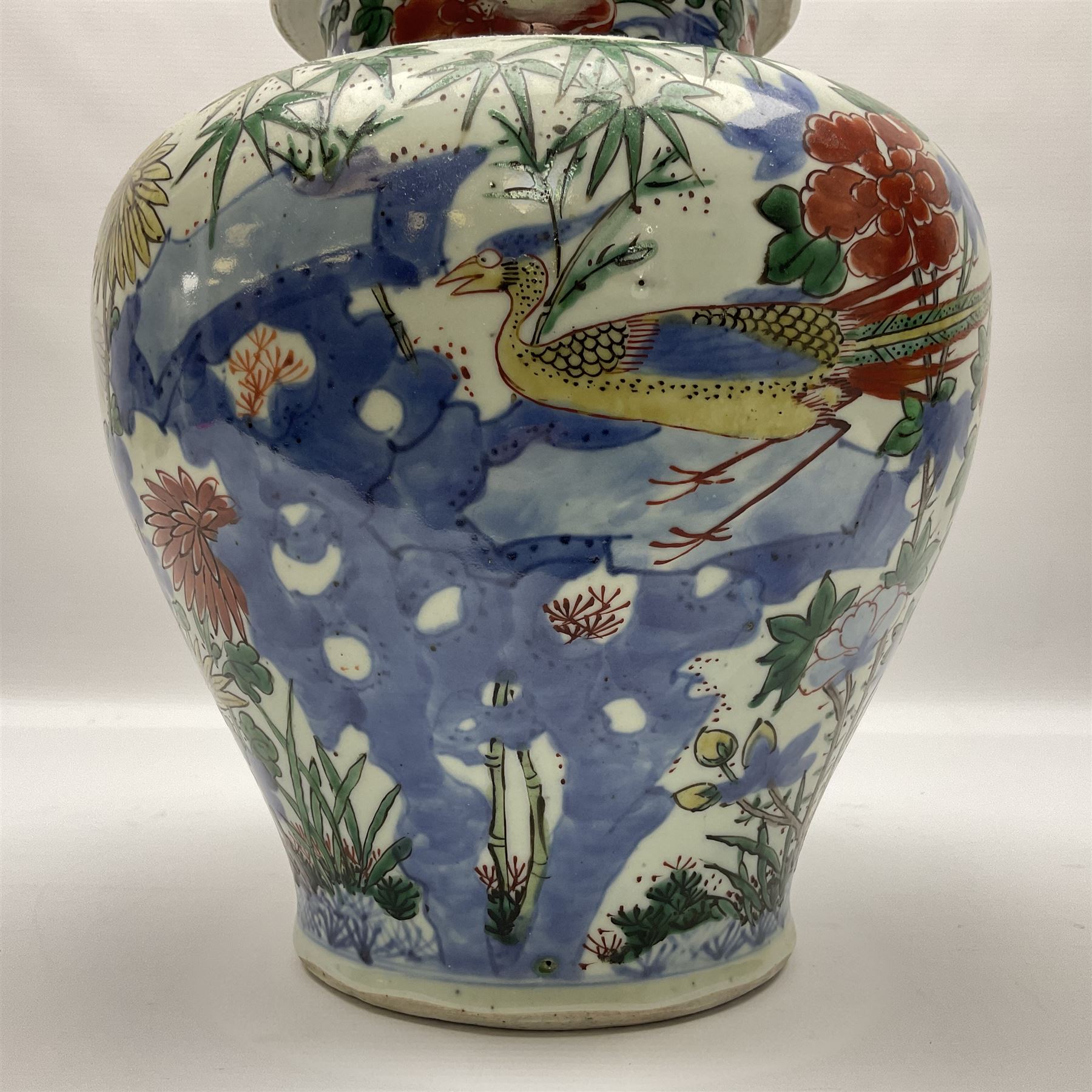 19th century Chinese Wucai vase and cover, decorated  with peacock on blue rockwork and other birds flying amongst tree peonies, H43cm