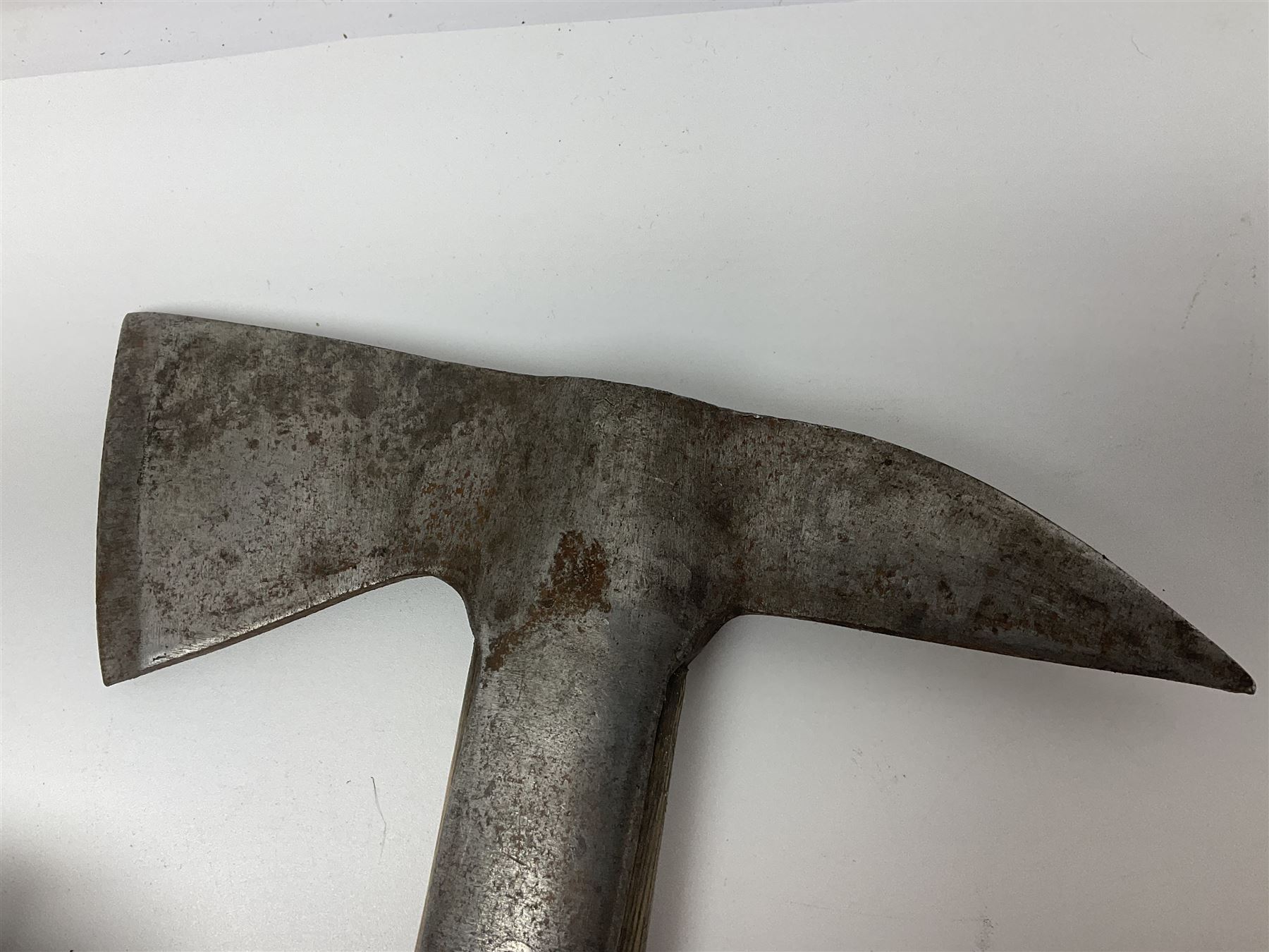 Post-War military type fireman's axe impressed 'PERKS 1953/54' with additional indistinct mark probably WD arrow, ash handle L39cm; and another stonemason's(?) double headed axe with mallet shaped shaft (2)