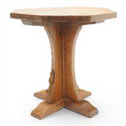 Mouseman - early 20th century adzed and figured burr oak coffee table of small proportions, the octagonal lightly adzed burr top raised on cruciform base and sledge feet, carved with tall mouse signature, by the workshop of Robert Thompson of Kilburn 