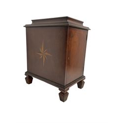 Regency style mahogany pedestal cabinet, sarcophagus top over single door enclosing drawer, the sides inlaid with star motifs, on square tapering lobe carved feet
