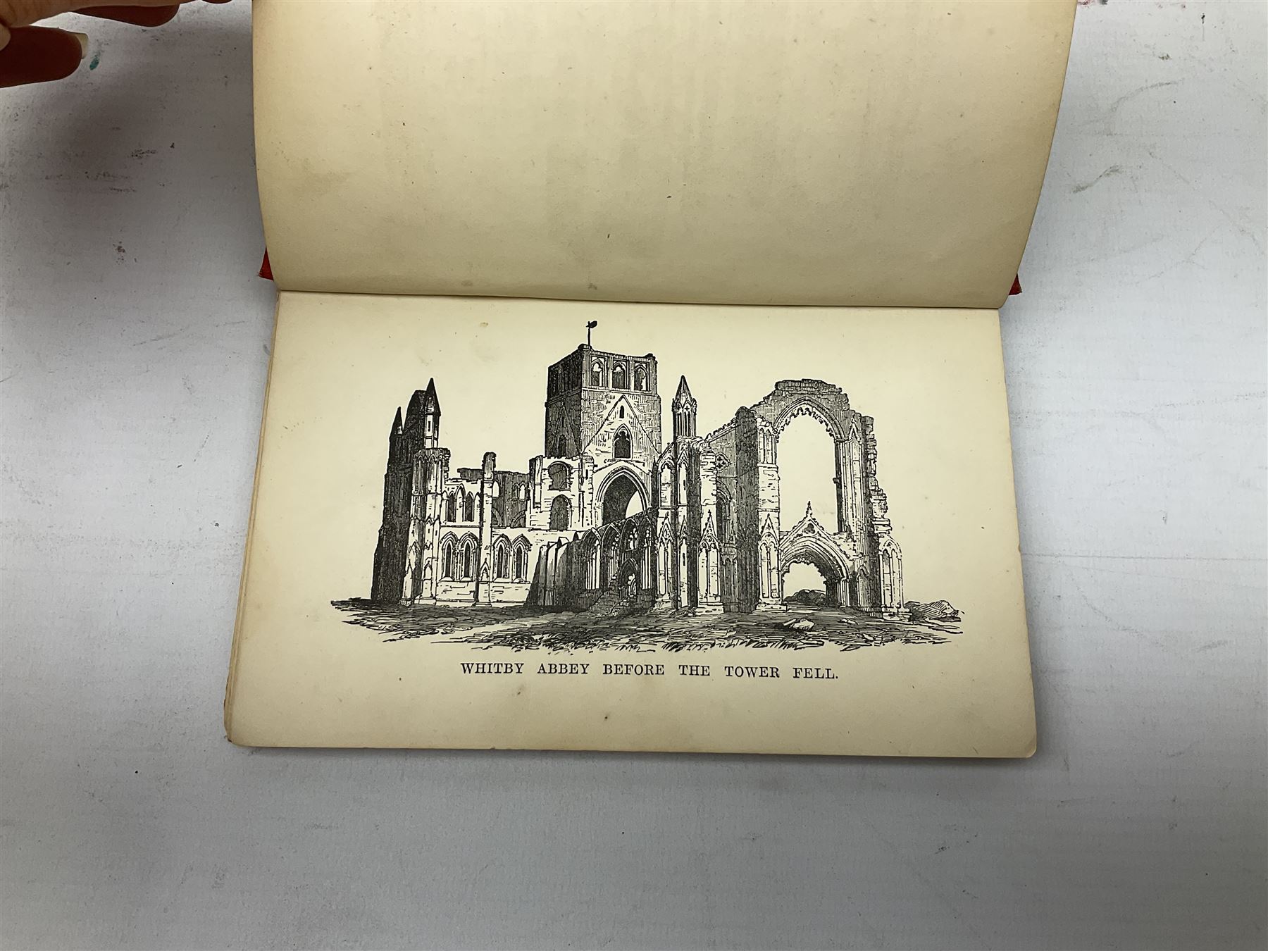 Quantity of books and postcards predominantly of Whitby interest including Hornes' Guide to Whitby 1890 and Hornes' Tourist map of Whitby, A Holiday Tour in and Around Whitby by H.S. Forman 1896 etc