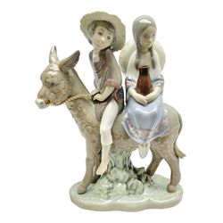 Lladro figure, Ride in the Country, modelled as modelled as a young boy and girl riding upon a donkey, sculpted by Jose Puche, with original box, no 5354, year issued 1986, year retired 1994, H20cm 