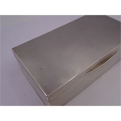 1930s silver mounted cigarette box, of rectangular form, with engine turned decoration throughout, the hinged cover opening to reveal a softwood lined interior, hallmarked Mappin & Webb Ltd, Birmingham 1938, H5.1cm, L16.5cm