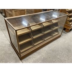 20th century oak and glazed haberdashery shop's display cabinet, fitted with twelve slides, on skirted base - THIS LOT IS TO BE COLLECTED BY APPOINTMENT FROM THE OLD BUFFER DEPOT, MELBOURNE PLACE, SOWERBY, THIRSK, YO7 1QY