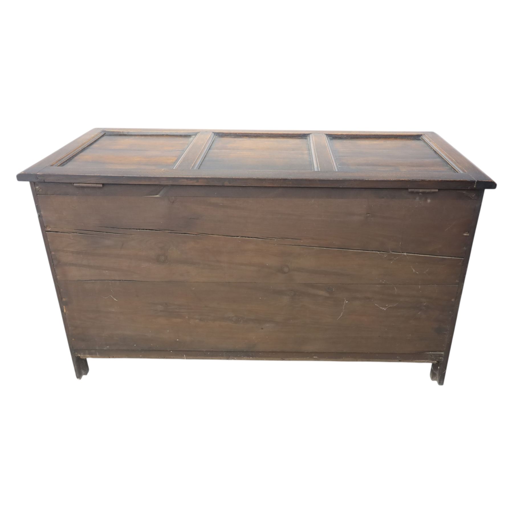 17th century design panelled oak blanket chest, hinged top above carved triple arch frieze, raised on individual carved claw feet