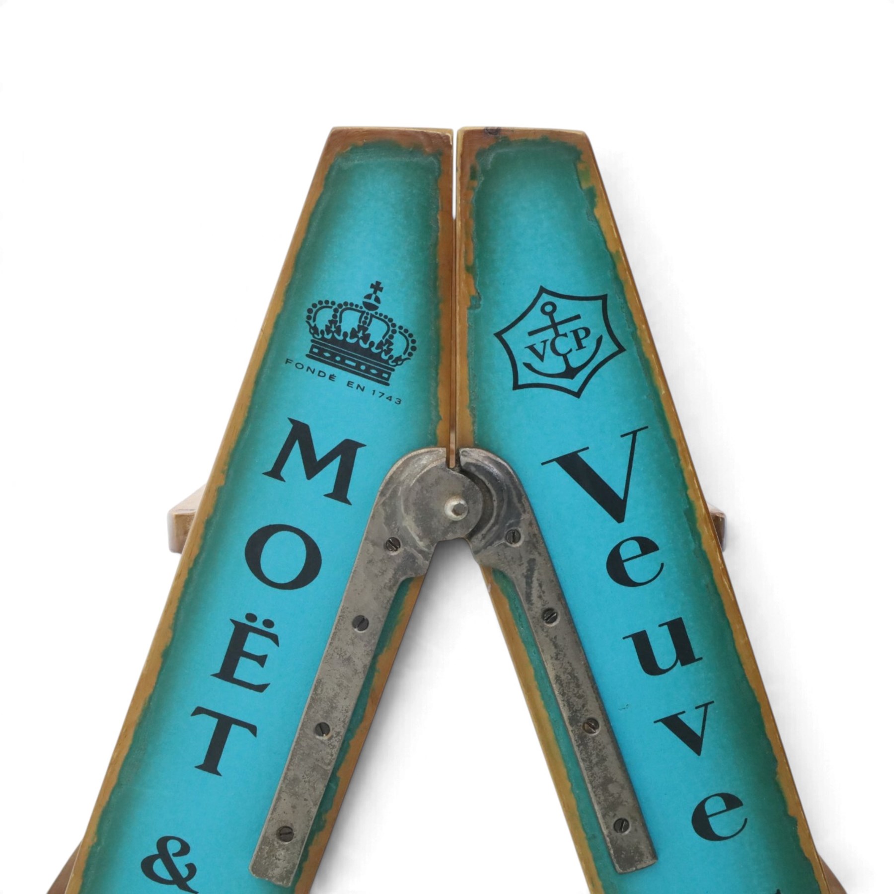 Contemporary wooden folding stepladder, three treads to each side, turquoise painted panels bearing champagne logos, with metal hinges and folding stays