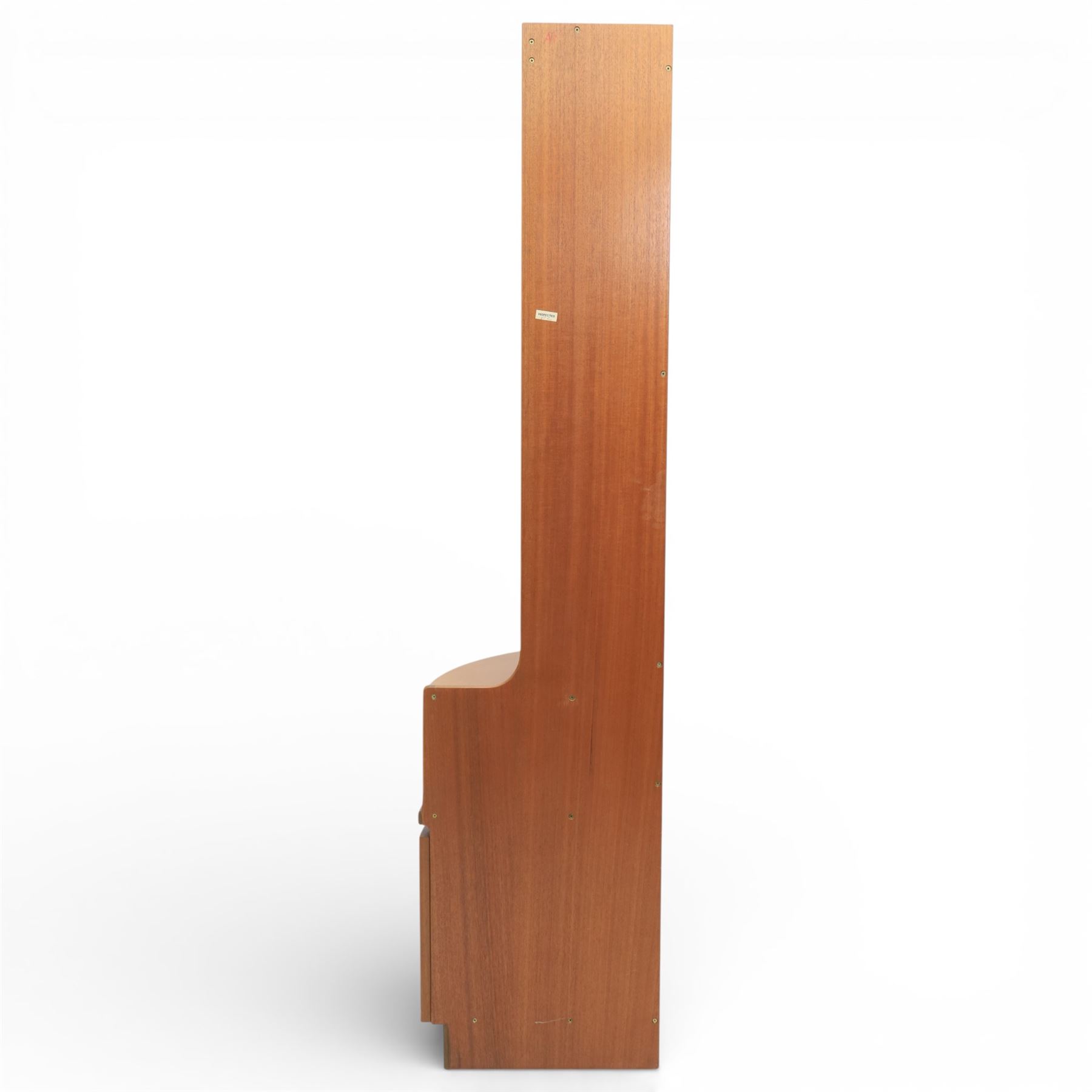 Nathan - teak corner cabinet, the upper section with moulded cornice and two fixed shaped open shelves, above a curved corner cupboard with twin signature square panelled doors, on a shaped plinth