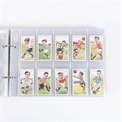 Collection of Edwardian and later Football related trading and cigarette cards, including forty-nine of fifty 1906 Ogden's Football Club Colours, 1922 PALS Footall series, ninety of one hundred 1925 Gallaher Famous Footballers, complete set of forty-four 1926 Ogden's Captains of Association Football Clubs and Colours, complete set of fifty 1927 Players Football Caricatures by MAC,  complete set of fifty 1927 Players Football Caricatures by RIP,  complete set of fifty 1930 Players Association Cup Winners, complete set of 50 1933 Ogdens AFC Nicknames etc, housed in brown cigarette card album