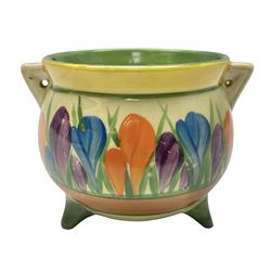 Clarice Cliff Bizarre for Newport Pottery, small bowl in the form of cauldron painted in the Crocus pattern, bordered by brown and yellow banding, with angular handles and raised upon three peg feet, with green printed mark and painted CROCUS beneath, circa 1929, H7cm