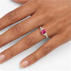 18ct gold pink pink spinel and diamond ring, single emerald cut spinel of approx 1.85 carat, with a round brilliant cut diamond set either side and diamond set shoulders, Birmingham assay mark