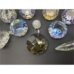 Swarovski Crystal paperweights, to include a globe with dove to the top, pyramid shapes etc, together with a large collection of boxes and stands  