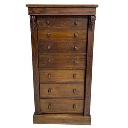 Victorian oak Wellington chest, fitted with seven drawers, lockable hinged side return