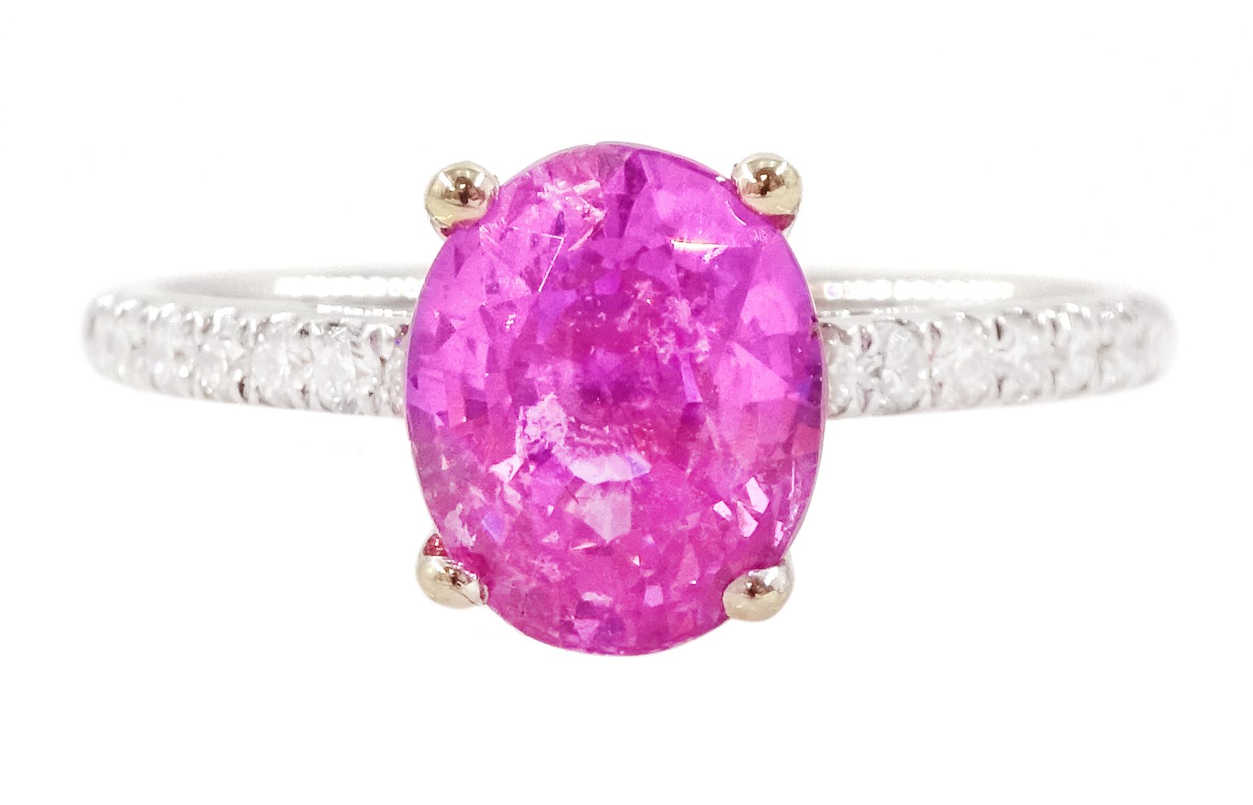 18ct white gold pink sapphire and diamond ring, single oval cut pink sapphire of approx 2.80 carat, with round brilliant cut diamond shoulders, hallmarked