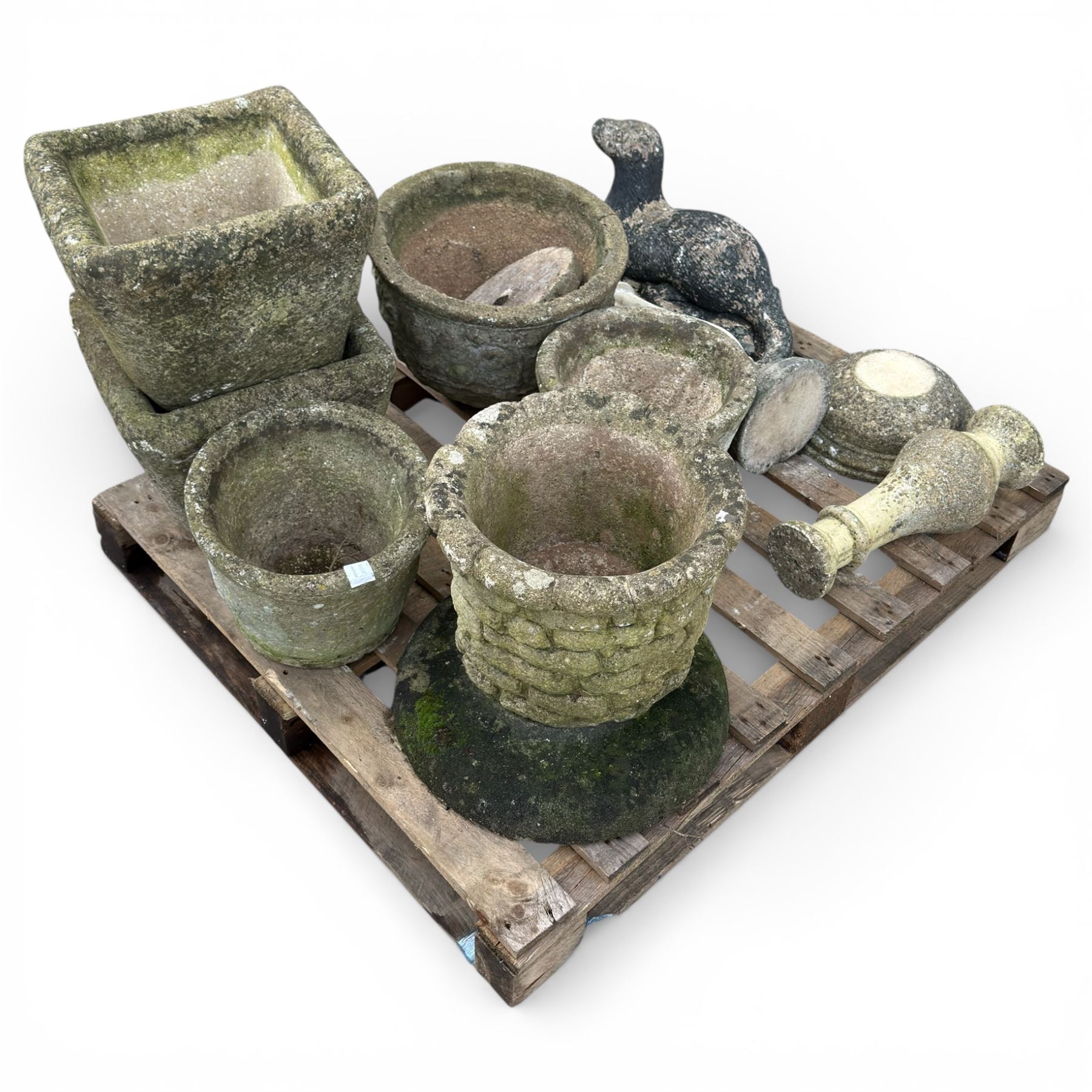 Collection of various cast stone planters and other stone items