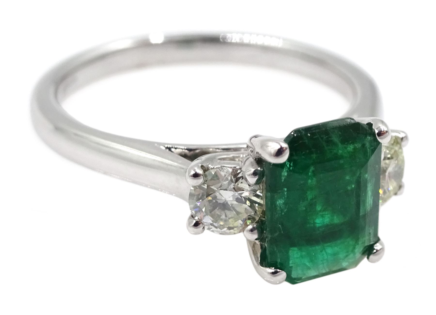 18ct white gold emerald and diamond three stone ring, hallmarked, emerald 1.16 carat, total diamond weight 0.39 carat, with World Gemological Institute Certificate 