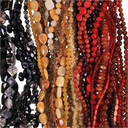 Seventy-six strings of polished gemstone and glass jewellery making beads and some loose beads, including black tourmaline quartz, sodalite, smoky quartz, mother of pearl, banded agate, jasper, maligano jasper, citrine, garnet etc, all of different cuts and sizes