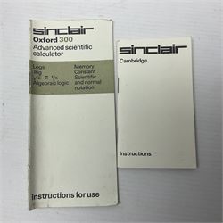 Four 1970s Sinclair electronic calculators - Cambridge in hard case with booklet; Scientific Programmable with Program Library and booklet; Scientific in hard case; and Oxford 300 in soft case with booklet; together with Texas PC-100 SR56 programmable slide-rule calculator on base station with readout, two booklets, keys and cover, serial no.9103093