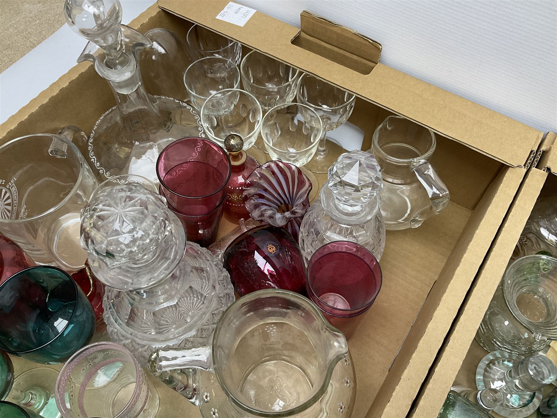 Millefiori paperweight, together with Caithness paperweight, Isle of Wight vase, cranberry glass tumblers, claret jug, decanters and other glassware, in three boxes 