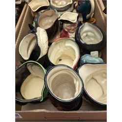 Collection of character and toby jugs and teapots, mostly Royal Doulton examples, in three boxes 