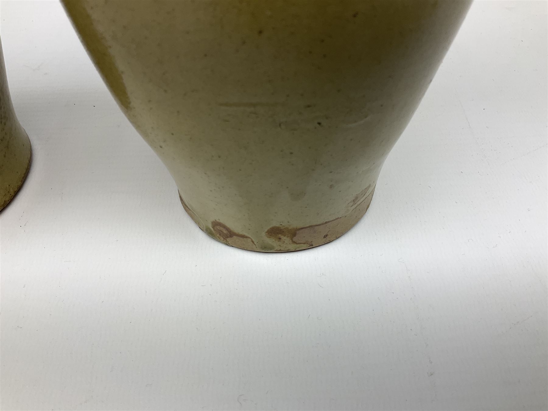  19th century salt glazed stoneware gin bottle impressed John Shaw, Red Lion Vaults, Whitefriargate, Hull of bulbous oval form H27cm and another with impressed label for J. Christie Mytongate Hull (2)  