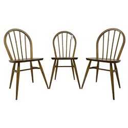 Ercol - 1960s set of three elm and beech 'Windsor' stick and hoop back chairs 