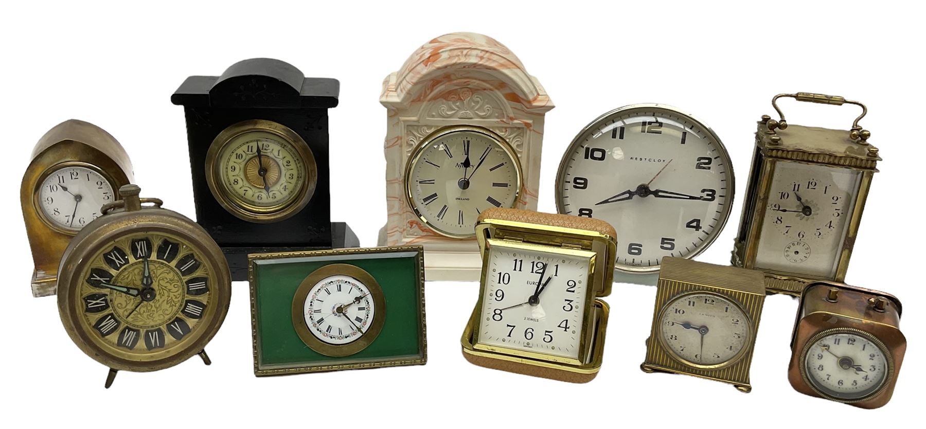 Miniature 'Zenith' travel alarm clock, in engine turned brass case with silvered numerical chapter ring, H5cm, together with other clocks to include Aynsley Portland Ware mantel clock, with moulded peacock design, Europa travelling clock, brass carriage clock, German copper clock of cube form etc