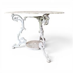 Victorian design cast aluminium circular garden table and four armchairs, ornate grape design in antique white paint