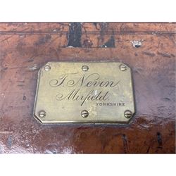 Leather shotgun case, the red baize lined interior with the trade labels of Westley Richards & Co., London, a brass plaque inscribed 'T Nevin, Mirfield, Yorkshire' to cover, with key, case to fit barrel 76cm (30 inches)  
