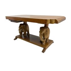 Hardwood coffee table on carved elephant