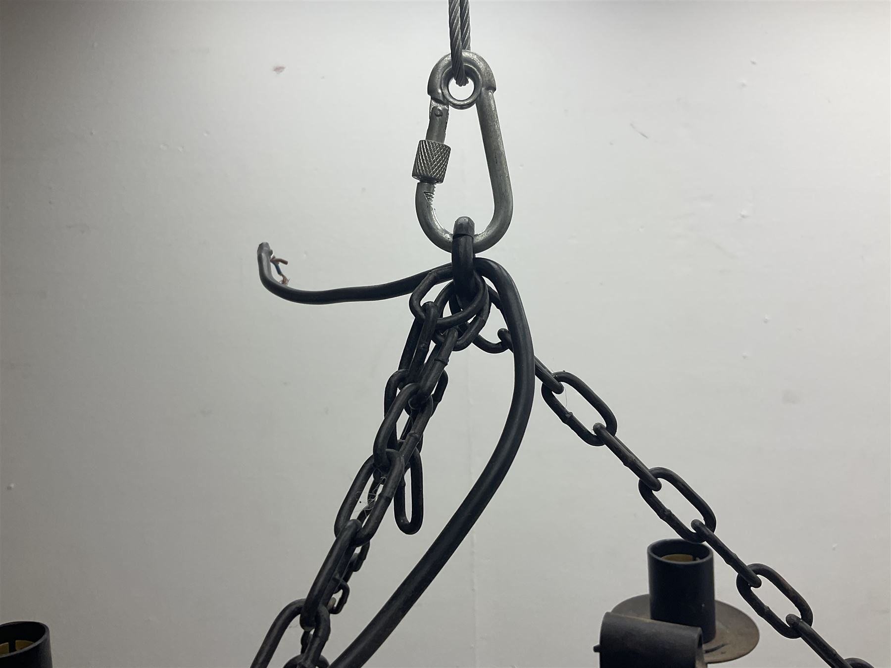 Pair of gothic style wrought iron ceiling lights, each with four branches, D58cm