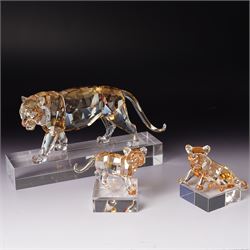 Swarovski, Endangered Wildlife, Tiger and two cubs, each with box, together with glass stands 