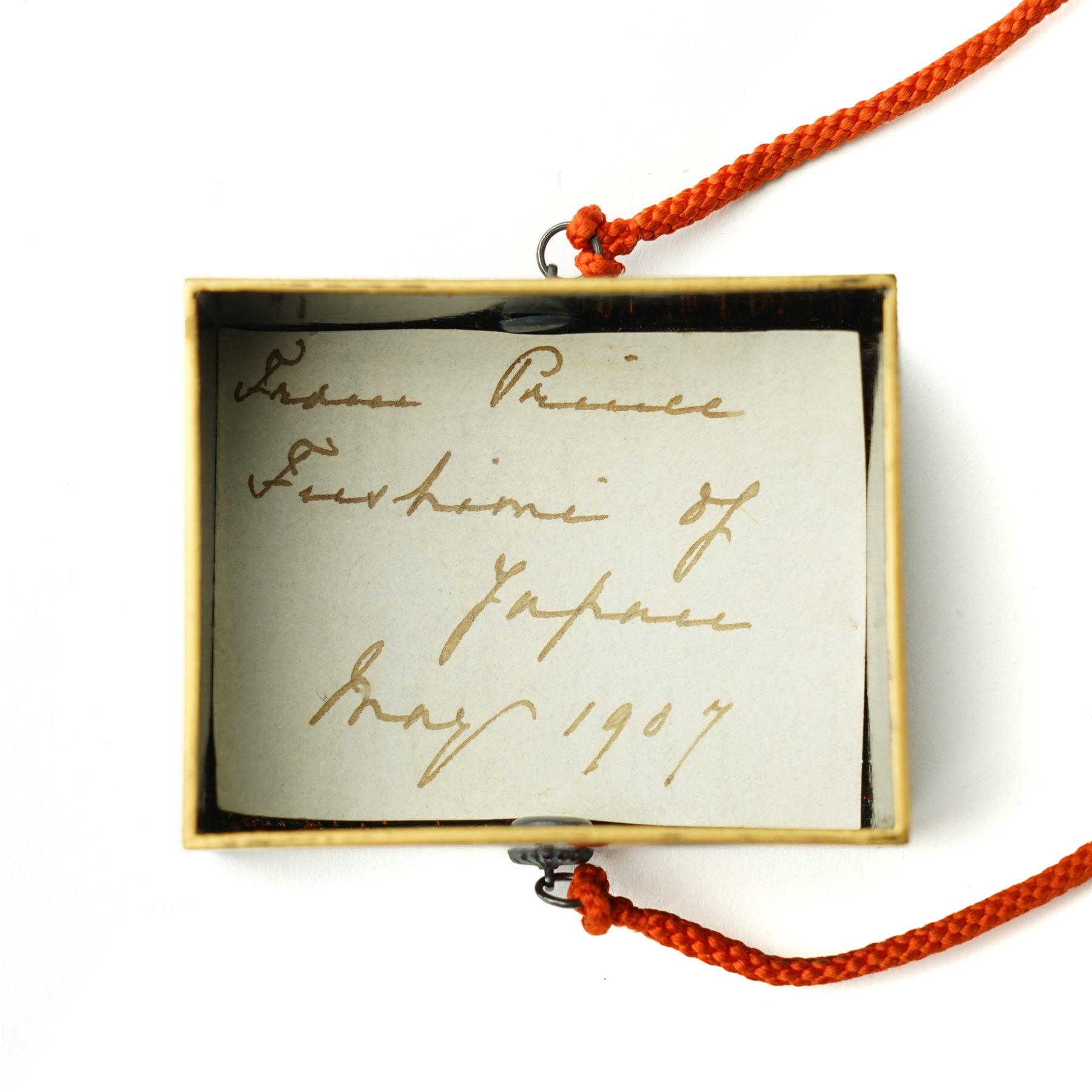 Japanese Meiji period lacquerware box with maki-e decoration, decorated centrally with the Chrysanthemum Seal, each side with trailing foliate decoration, the internal body with nashiji lacquer, with note reading 'From Prince Fushimi [Sadanaru] of Japan - May 1907', 5.5cm x 4.5cm
Provenance: Prince Sadanaru Fushimi of Japan visited London in May 1907, to be made an Honorary Member of the Military Division of the First Class by King Edward VII. The great-uncle of the vendor, by repute, worked in the Royal Household at this time, starting at age 15. It is unclear how he came to acquire the item, however it is known that he worked closely with Edward VIII. He would serve the family until his retirement, where he would be granted a grace-and-favour home on the Sandringham estate. Lot 6009, the cigarette case, is also property of the same vendor. 