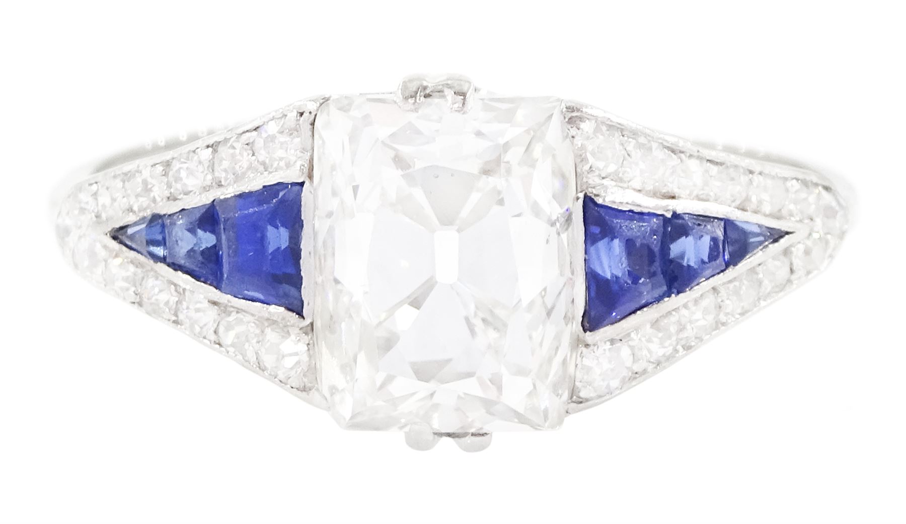 Platinum diamond and sapphire ring, the principal old cushion cut diamond of approx 1.50 carat, each side set with three graduating calibre cut sapphires and old cut diamond surround