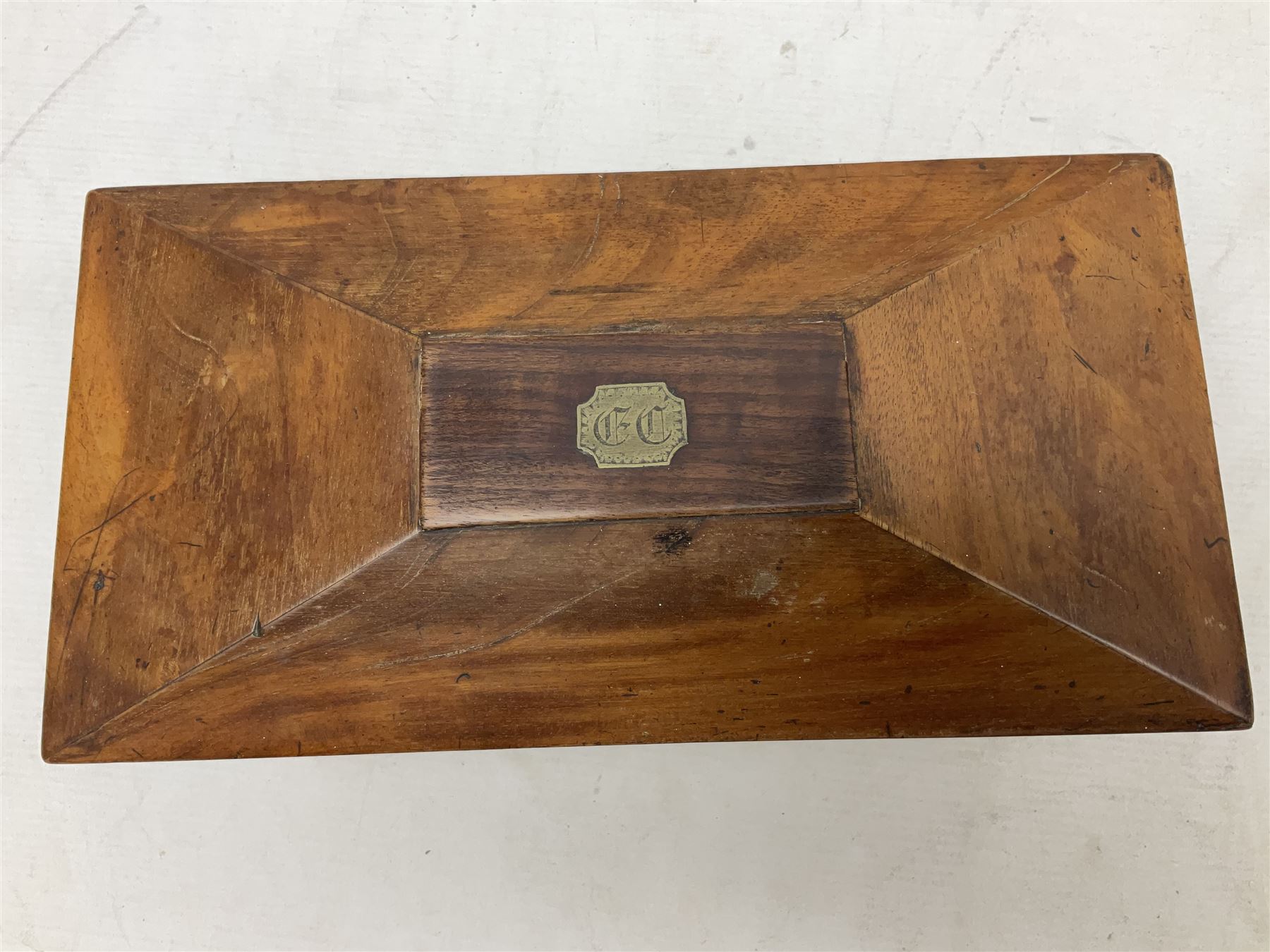 Walnut tea caddy of sarcophagus form, two division lidded interior with a later glass mixing bowl, upon four brass bun feet together with a walnut sewing box with mother of pearl inlaid decoration, tea caddy H16cm