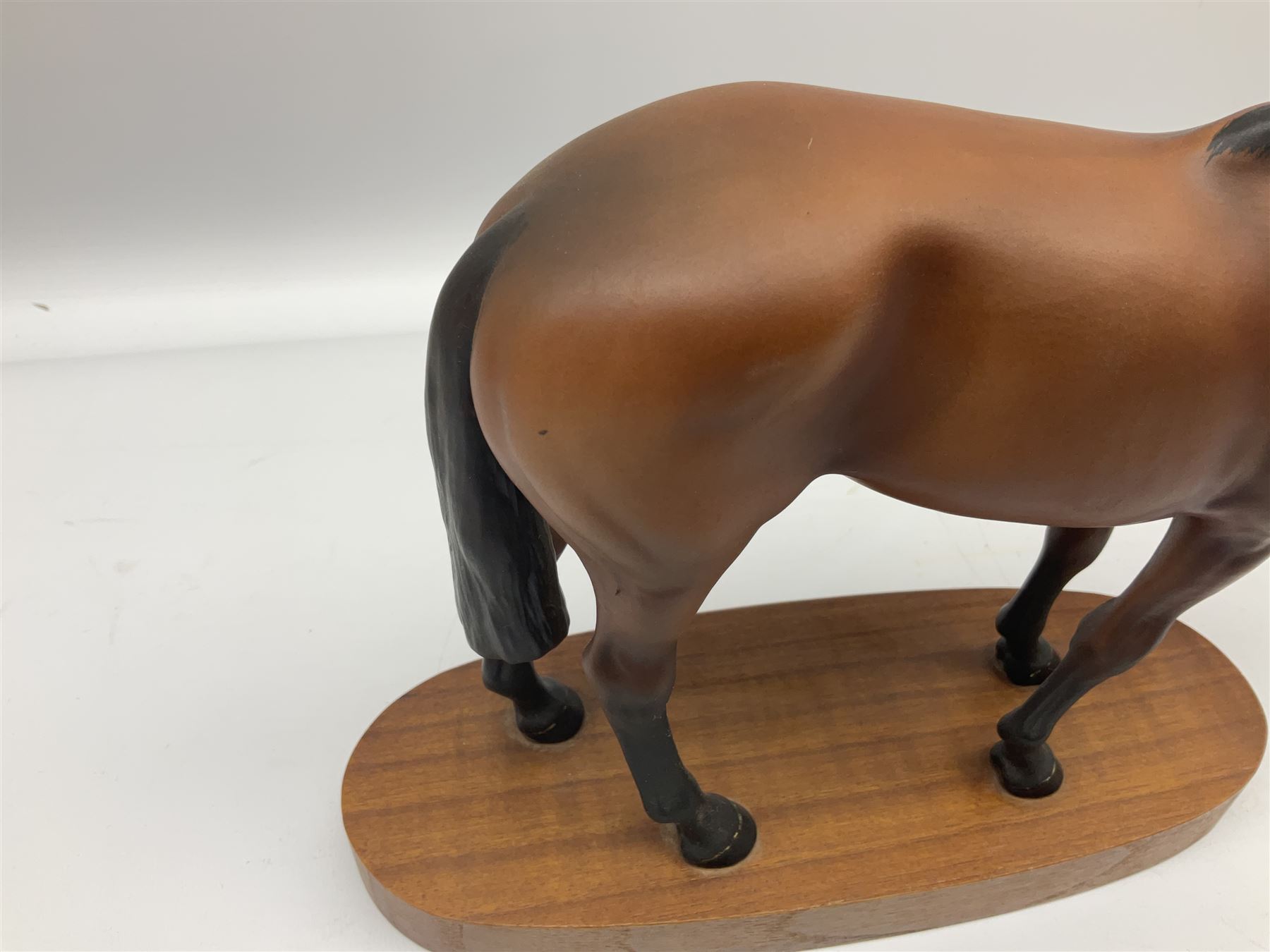 Beswick 'Mill Reef' horse figure, on a wooden plinth together with Beswick Ware horse figure 'Red Rum' on wood plinth, both with printed mark beneath