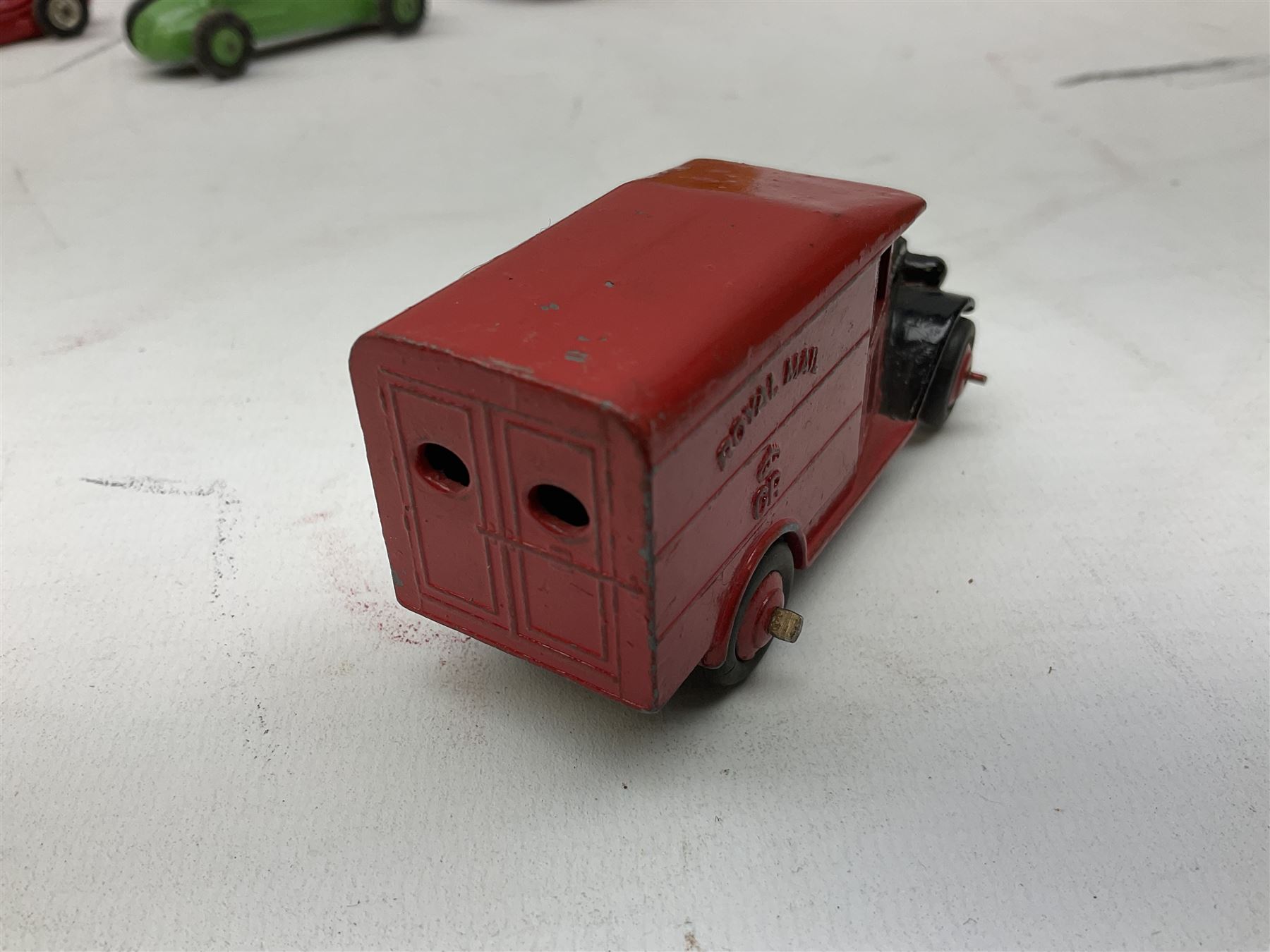 Dinky - five unboxed and playworn die-cast models comprising Supertoys Big Bedford Van 'Heinz' No.923; A.E.C. Monarch Thompson Tank; Maserati Racing Car No.231; H.W.M. Racing Car 23J; and Royal Mail Van; together with a Corgi Mobilgas Tanker (6)