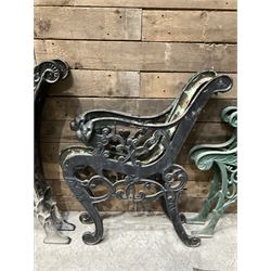 Four pairs of ornate cast iron bench ends (8)
