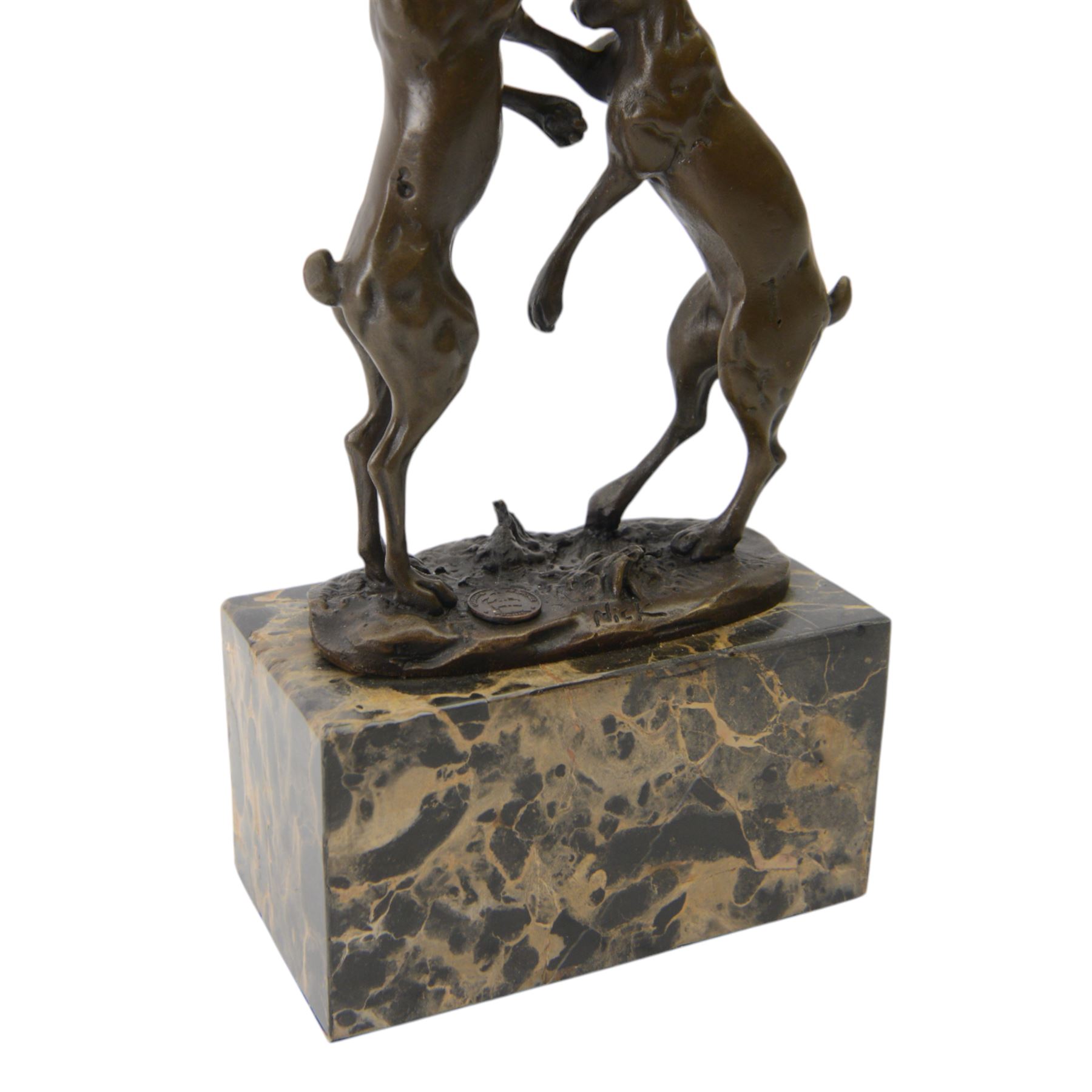 Mario Nick (Modern): two hares boxing, bronze figure group, signed Nick and bearing foundry mark, upon rectangular stone plinth, overall H23.5cm