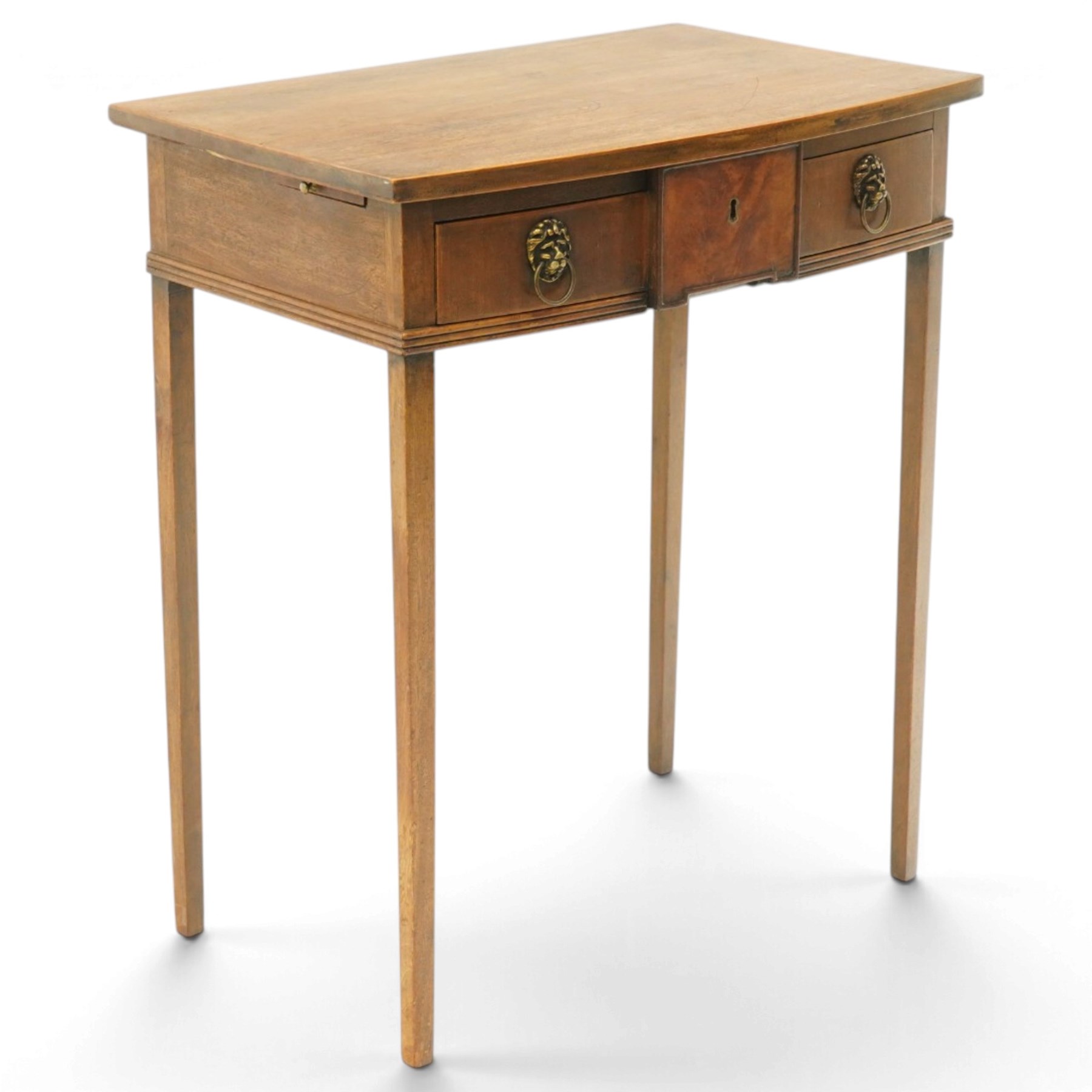 George III mahogany bowfront side table, fitted with single frieze drawer with brass lion-mask handles and twin candle-rests to each side, lower reeded edge on square tapering supports