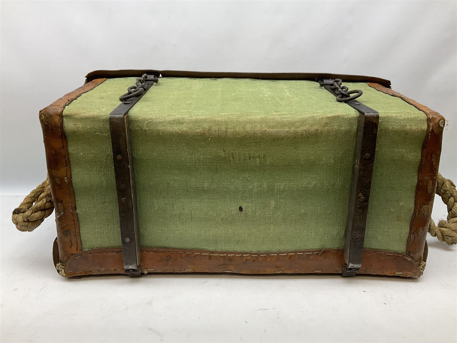 WW2 British Army RAMC 'Regimental Medical Pannier', well marked externally and dated 1941, stamped May 1943 internally, canvas covered wicker form with leather edges, hinged top and fall front with two rope carrying handles, fitted iron locking straps with securing chains; contains various unused field dressings and bandages with WW2 dates and two pillows; original label under lid L79cm