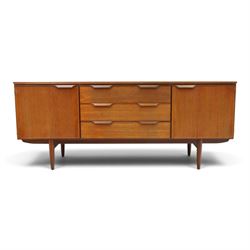 Frank Guille for Austinsuite - mid-20th century teak sideboard, fitted with three central ...