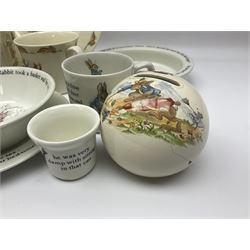 Collection of Royal Doulton Bunnykins and Wedgwood Peter Rabbit nursery ware, including cups, bowls, money boxes, etc 